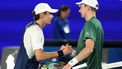 Australia's Alex De Minaur (L) shakes hands with Netherlands' Botic van de Zandschulp after their men's singles match on day three of the Australian Open tennis tournament in Melbourne on January 14, 2025. 
Martin KEEP / AFP
