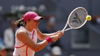 Poland's Iga Swiatek returns a ball to Spain's Sara Sorribes Tormo during the 2024 WTA Tour Madrid Open tournament last sixteen tennis match at Caja Magica in Madrid on April 29, 2024.  
OSCAR DEL POZO / AFP