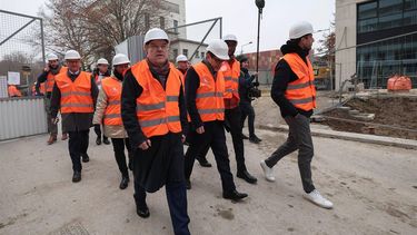 President of the International Olympic Committee (IOC) Thomas Bach (CL) walks through the Olympic Village during a visit with members of the Executive Board of the International Olympic Committee, in Saint-Ouen, northern Paris, on December 1, 2023. 
FRANCK FIFE / AFP