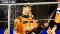 epa11619186 British driver Lando Norris of McLaren F1 Team celebrates on the podium after winning the Singapore Formula One Grand Prix at the Marina Bay Street Circuit, Singapore, 22 September 2024.  EPA/TOM WHITE