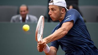 Netherlands' Tallon Griekspoor plays a backhand return to Serbia's Novak Djokovic during their ATP 250 Geneva Open tennis tournament single quarter final match, in Geneva on May 23, 2024. 
Fabrice COFFRINI / AFP