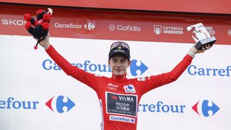 epa12371515 Danish cyclist Jonas Vingegaard of Team Visma in the overall leader red jersey after the 19th stage of La Vuelta a Espana cycling race that covers 161.9 km between Rueda and Guijuelo towns, Spain, 12 September 2025.  EPA/Javier Lizon