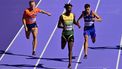 Netherlands' Nick Smidt, Jamaica's Roshawn Clarke and France's Wilfried Happio compete in the men's 400m hurdles heat of the athletics event at the Paris 2024 Olympic Games at Stade de France in Saint-Denis, north of Paris, on August 5, 2024. 
Martin  BERNETTI / AFP