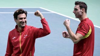 Spain's Pedro Martinez Portero (R) celebrates with Spain's captain David Ferrer (L) gesturing at the end of the 2025 Davis Cup semi-final doubles tennis match against Germany at the Super Tennis Arena in Bologna, northen Italy, on November 22, 2025. 
Tiziana FABI / AFP