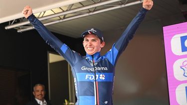 Groupama-FDJ team's Romain Gregoire, celebrates as he arrives on the podium after winning the 