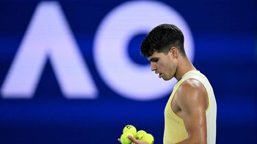 epa11082518 Carlos Alcaraz of Spain prepares to serve during his round 1 match against Richard Gasquet of France on Day 3 of the 2024 Australian Open at Melbourne Park in Melbourne, Australia, 16 January 2024.  EPA/LUKAS COCH AUSTRALIA AND NEW ZEALAND OUT