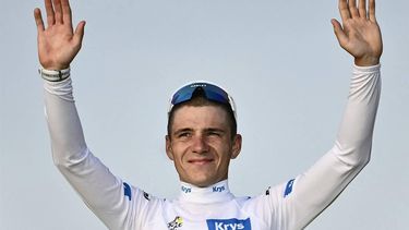 Soudal Quick-Step team's Belgian rider Remco Evenepoel celebrates on the podium with the best young rider's white jersey after the 21st stage of the 111th edition of the Tour de France cycling race, a 33,7 km individual time-trial between Monaco and Nice, on July 21, 2024. 
Marco BERTORELLO / AFP