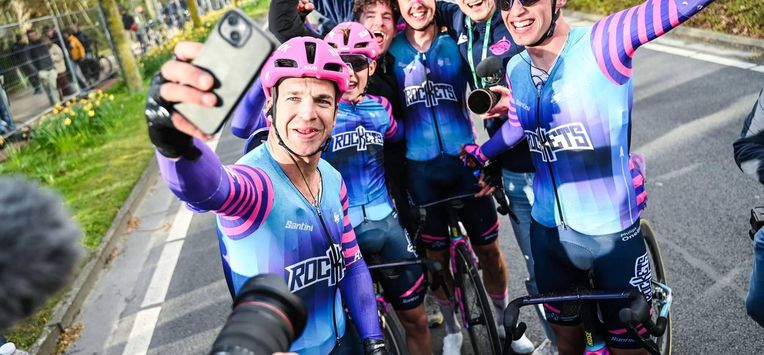 Netherlands' Dylan Groenewegen of Unibet Rose Rockets (L) takes a selfie with teammates  after winning the 'Ronde van Brugge' men's elite one-day cycling race, 202,9 km from and to Bruges on March 25, 2026. 
ELIAS ROM / Belga / AFP