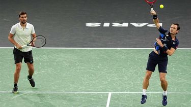 Netherlands' Wesley Koolhof (R) serves next to Croatia's Nikola Mektic (L) as they play against England's Lloyd Glasspool and Czechia's Adam Pavlasek during their men's doubles final match on day seven of the Paris ATP Masters 1000 tennis tournament at the Accor Arena - Palais Omnisports de Paris-Bercy - in Paris on November 3, 2024. 
Dimitar DILKOFF / AFP