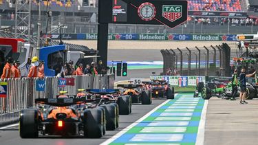 Cars line up to start the first practice session of the Formula One Chinese Grand Prix at the Shanghai International Circuit in Shanghai on March 21, 2025. 
HECTOR RETAMAL / AFP