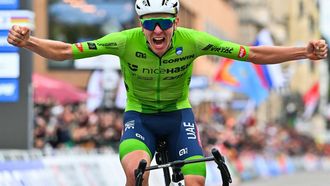 Slovenia's Tadej Pogacar celebrates as he crosses the finish line to win the men's Elite Road Race cycling event during the UCI 2024 Road World Championships, in Zurich, on September 29, 2024. 
Fabrice COFFRINI / AFP