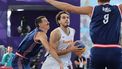 Netherlands' #04 Jan Driessen (C) tries to shoot past Serbia's #03 Strahinja Stojacic and Serbia's #09 Mihailo Vasic (R) in the men's pool round 3x3 basketball game between the Netherlands and Serbia during the Paris 2024 Olympic Games at La Concorde in Paris on August 1, 2024. 
David GRAY / AFP