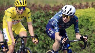 epa11476039 Yellow jersey Slovenian rider Tadej Pogacar (L) of UAE Team Emirates and Danish rider Jonas Vingegaard of Team Visma Lease a Bike in action during the 14th stage of the 2024 Tour de France cycling race over 151km from Pau to Saint-Lary-Soulan Pla d'Adet, France, 13 July 2024.  EPA/GUILLAUME HORCAJUELO