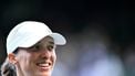 Poland's Iga Swiatek celebrates after winning against Denmark's Clara Tauson during their women's singles fourth round tennis match on the eighth day of the 2025 Wimbledon Championships at The All England Lawn Tennis and Croquet Club in Wimbledon, southwest London, on July 7, 2025. 
Kirill KUDRYAVTSEV / AFP