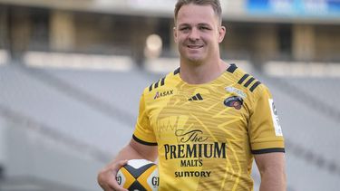 New Zealand All Blacks captain Sam Cane poses in his new uniform following a press conference for the Japanese rugby side Suntory Sungoliath at Ajinomoto Stadium in Chofu, Tokyo on November 28, 2023. 
Richard A. Brooks / AFP