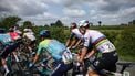 XDS Astana Team's Colombian rider Sergio Andres Higuita Garcia (C) and UAE Team Emirates XRG's Slovenian rider Tadej Pogačar (R) cycle with the pack of riders during the 1st stage of the 77th edition of the Criterium du Dauphine cycling race, 195,8 km between Domérat and Montlucon, on June 8, 2025. 
Anne-Christine POUJOULAT / AFP