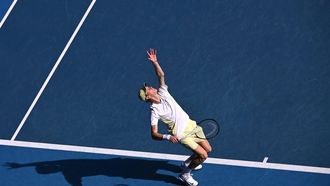 Italy's Jannik Sinner serves against Denmark's Holger Rune during their men's singles match on day nine of the Australian Open tennis tournament in Melbourne on January 20, 2025. 
WILLIAM WEST / AFP