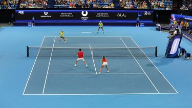 epa11055068 Matthew Ebden and Storm Hunter (top) of Australia in action against Dejana Radanovic and Nikola Cacic of Serbia during their quarterfinal match of the 2024 United Cup at RAC Arena in Perth, Australia, 03 January 2024.  EPA/RICHARD WAINWRIGHT  AUSTRALIA AND NEW ZEALAND OUT