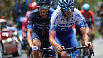 Team Jayco Alula's Australian rider Chris Harper (R) cycles ahead of Groupama - FDJ's French rider Thibaut Pinot during the 20th stage of the 110th edition of the Tour de France cycling race 133 km between Belfort and Le Markstein Fellering, in Eastern France, on July 22, 2023. 
Thomas SAMSON / AFP