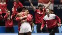 2023-11-12 19:14:35 Canada's Leylah Fernandez (L) celebrates with Canada's captain Heidi El Tabakh, next to Canada's Marina Stakusic (R), after beating Italy's Jasmine Paolini during the final singles tennis match between Italy and Canada on the last day of the Billie Jean King Cup Finals 2023 in La Cartuja stadium in Seville on November 12, 2023. 
CRISTINA QUICLER / AFP