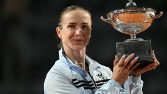 Ukraine's Elina Svitolina poses with the trophy after winning the WTA Rome Open tennis tournament final against USA's Coco Gauff at Foro Italico in Rome on May 16, 2026.  
Tiziana FABI / AFP