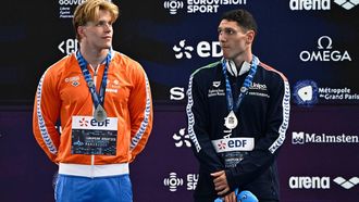 Tied silver medallists Netherlands' Koen De Groot (L) and Italy's Simone Cerasuolo pose on the podium of the men's 50m breaststroke swimming event during the LEN European Aquatics Championships at the Olympic Aquatic Centre in Saint-Denis, northern suburbs of Paris, on August 15, 2026. 
JULIEN DE ROSA / AFP