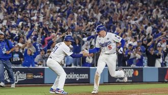 epa12487202 Los Angeles Dodgers first baseman Freddie Freeman (R) celebrates with Dodgers third base coach Dino Ebel (L) while rounding the bases after hitting a game-winning solo home run against the Toronto Blue Jays during the eighteenth inning of the MLB World Series game three between the Toronto Blue Jays and the Los Angeles Dodgers in Los Angeles, California, USA, 27 October 2025.  EPA/ALLISON DINNER