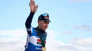 Belgian Tim Merlier (Soudal Quick-Step) celebrates with his medal on the podium after winning the third stage between Al-Ula International Airport and Al-Ula Camel Cup Track, during the Al-Ula Tour cycling race at Al-Ula Camel Cup Track on February 1, 2024. 
Anne-Christine POUJOULAT / AFP