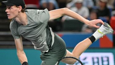 Italy's Jannik Sinner serves to Serbia’s Novak Djokovic during their men's singles final match at the Shanghai Masters tennis tournament in Shanghai on October 13, 2024. 
HECTOR RETAMAL / AFP