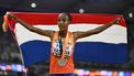 2023-08-26 21:17:02 Netherlands' silver medallist Sifan Hassan celebrates with her national flag after the women's 5000m final during the World Athletics Championships at the National Athletics Centre in Budapest on August 26, 2023. 
Jewel SAMAD / AFP