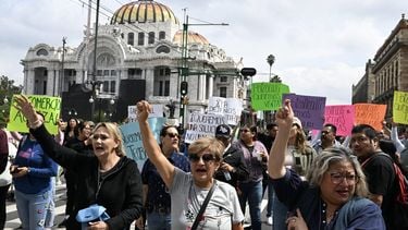 Workers from shops and restaurants located within the security perimeter of the FIFA Fan Fest installed at El Zocalo square for the upcoming FIFA World Cup block an avenue in protest against the closure of their workplaces due to demonstrations by the National Coordinator of Education Workers (CNTE) in Mexico City on June 8, 2026. 
Yuri CORTEZ / AFP