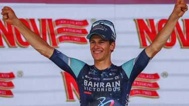 Stage winner Bahrain - Victorious Belgian rider Alec Segaert  celebrates on the podium of the 12th stage of the Giro d'Italia 2026 - Tour of Italy cycling race between Imperia and Novi Ligure, Italy, on May 21, 2026. 
Luca Bettini / AFP