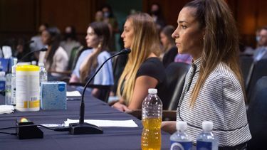 (L-R)US Olympic gymnasts Simone Biles, McKayla Maroney, gymnast Maggie Nichols, and US Olympic gymnast Aly Raisman, testify during a Senate Judiciary hearing about the Inspector General's report on the FBI handling of the Larry Nassar investigation of sexual abuse of Olympic gymnasts, on Capitol Hill, September 15, 2021, in Washington, DC. 
SAUL LOEB / POOL / AFP