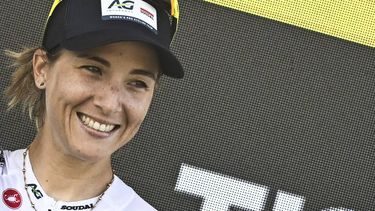 AG Insurance - Soudal Team's Mauritius rider Kimberley Le Court Pienaar celebrates on the podium after winning the 5th stage (out of 9) of the fourth edition of the Women's Tour de France cycling race, 165.8 km from Chasseneuil-du-Poitou to Gueret, in Gueret, central France on July 30, 2025. 
JULIEN DE ROSA / AFP