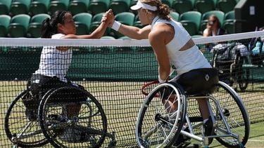 Japan's Yui Kamiji (L) and Netherlands' Diede De Groot shake hands ahead of their women's wheelchair singles final tennis match on the thirteenth day of the 2026 Wimbledon Championships at The All England Lawn Tennis and Croquet Club in Wimbledon, southwest London, on July 11, 2026. 
Adrian Dennis / AFP