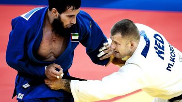 PARIJS - Judoka Michael Korrel in actie tegen Dzhafar Kostoev (VAE) op de Olympische Spelen. ANP REMKO DE WAAL