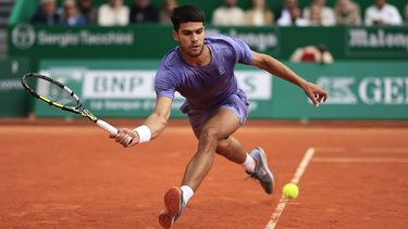 Spain's Carlos Alcaraz plays a forehand return to Italy's Lorenzo Musetti during the Monte Carlo ATP Masters Series Tournament final tennis match at the Monte Carlo Country Club in Roquebrune-Cap-Martin on April 13, 2025. 
Valery HACHE / AFP