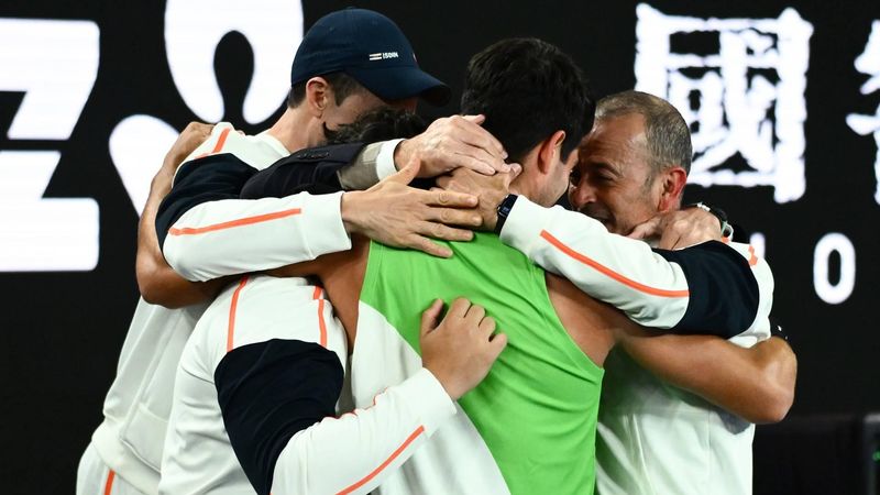 epa12697193 Carlos Alcaraz of Spain celebrates with his team after winning the Men’s Singles final match against Novak Djokovic of Serbia at the Australian Open tennis tournament in Melbourne, Australia, 01 February 2026.  EPA/JOEL CARRETT AUSTRALIA AND NEW ZEALAND OUT