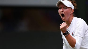 Czech Republic's Barbora Krejcikova celebrates winning the first set against Italy's Jasmine Paolini during their women's singles final tennis match on the thirteenth day of the 2024 Wimbledon Championships at The All England Lawn Tennis and Croquet Club in Wimbledon, southwest London, on July 13, 2024. 
HENRY NICHOLLS / AFP