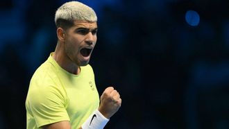 Spain's Carlos Alcaraz celebrates a point against Australia's Alex De Minaur at the ATP Finals tennis tournament in Turin on November 9, 2025. 
Marco BERTORELLO / AFP