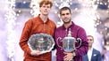 Spain's Carlos Alcaraz and Italy's Jannik Sinner pose with their trophies after Alcaraz won the men's singles final tennis match on day fifteen of the US Open tennis tournament at the USTA Billie Jean King National Tennis Center in New York City on September 7, 2025. 
CHARLY TRIBALLEAU / AFP
