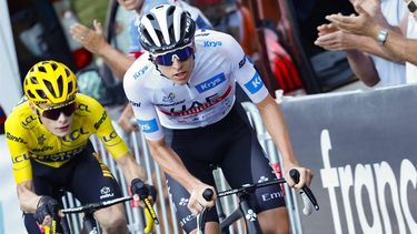 2023-07-16 19:25:54 UAE Team Emirates' Slovenian rider Tadej Pogacar wearing the best young rider's white jersey cycles ahead of Jumbo-Visma's Danish rider Jonas Vingegaard wearing the overall leader's yellow jersey in the final ascent of Saint-Gervais-les-Bains in the last kilometers of the 15th stage of the 110th edition of the Tour de France cycling race, 179 km between Les Gets Les Portes du Soleil and Saint-Gervais Mont-Blanc, in the French Alps, on July 16, 2023. 
Etienne GARNIER / POOL / AFP