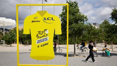 A display shaped like the Tour de France leader's yellow jersey promoting the race's 'Grand Depart' is pictured in Barcelona on May 7, 2026. The 2026 Tour de France cycling race's Grand Depart first stage will be held in Barcelona on July 4, 2026 with Spain's north eastern Catalonia region also hosting the second and third stages of La Grand Boucle.
Josep LAGO / AFP