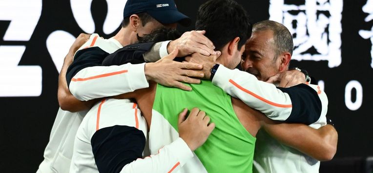 epa12697193 Carlos Alcaraz of Spain celebrates with his team after winning the Men’s Singles final match against Novak Djokovic of Serbia at the Australian Open tennis tournament in Melbourne, Australia, 01 February 2026.  EPA/JOEL CARRETT AUSTRALIA AND NEW ZEALAND OUT