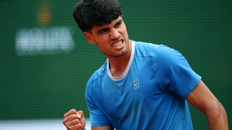 Spain's Carlos Alcaraz celebrates after winning a game against Argentina's Sebastian Baez during the Monte Carlo ATP Masters Series Tournament round of 64 tennis match on Court Rainier III at the Monte-Carlo Country Club in Roquebrune-Cap-Martin, south-eastern France on April 7, 2026. 
Valery HACHE / AFP