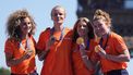 Members of team Netherlands, women's field hockey gold medallists, celebrate on stage at the Champions Park at Trocadero during the Paris 2024 Olympic Games in Paris on August 10, 2024, with the Eiffel Tower visible in the background. 
Dimitar DILKOFF / AFP