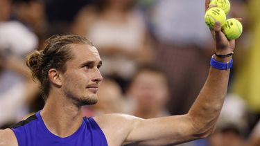 Germany's Alexander Zverev prepares to throw signed tennis balls to fans after defeating USA's Brandon Nakashima during their men's singles round of 16 tennis match on day seven of the US Open tennis tournament at the USTA Billie Jean King National Tennis Center in New York City, on September 1, 2024. 
KENA BETANCUR / AFP