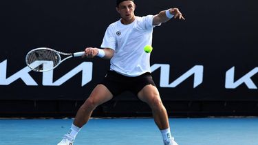 Netherlands' Tallon Griekspoor hits a return against France's Arthur Fils during their men's singles match on day five of the Australian Open tennis tournament in Melbourne on January 18, 2024. 
Martin KEEP / AFP