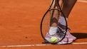 epa12116705 Ons Jabeur from Tunisia picks up a tennis ball during a training session for the French Open tennis tournament at Roland Garros in Paris, France, 19 May 2025. The 2025 French Open will be held from 25 May to 08 June 2025.  EPA/Teresa Suarez
