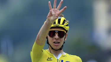 epa11487770 Yellow jersey Slovenian rider Tadej Pogacar of UAE Team Emirates celebrates as he crosses the finish line to win the 19th stage of the 2024 Tour de France cycling race over 144km from Embrun to Isola 2000, France, 19 July 2024.  EPA/GUILLAUME HORCAJUELO